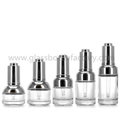 China 20ml,30ml and 50ml Clear Glass Essence Bottles With Silver Press Droppers for sale