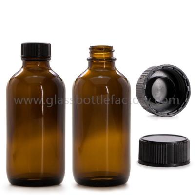 China 16oz Amber Boston Round Glass Bottle With Black Caps for sale