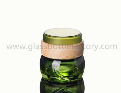 China 50g Hot Selling Green Glass Cosmetic Jar With Wood Lid for sale