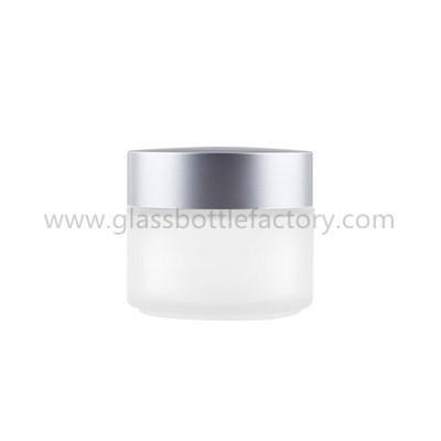 China 100g/100ml Frost Round Glass Cosmetic Jar With Silver Lid for sale