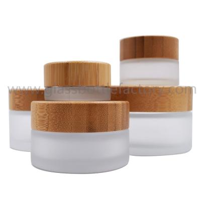 China 5g,15g,30g,50g,100g Frost Round Glass Cosmetic Jars With Bamboo Lids for sale