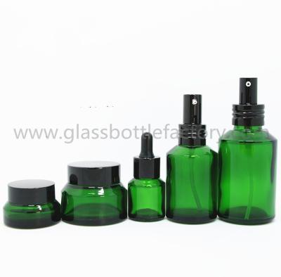 China 15ml,30ml,60ml,100ml,125ml,15g,30g,50g Green Color Sloping Shoulder Glass Lotions Bottles and Cosmetic Jars for sale