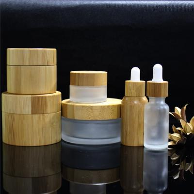 China 30ml Personal Care Products Cosmetics Glass Packaging Jar Lid Face Cream Container Glass Bamboo Cream Jar With Bamboo Cap for sale