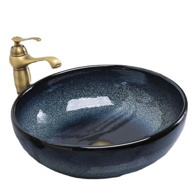 China Ceramic Splash-proof Single Bowl Art Basin Household Small Size Creative Mediterranean Above Counter Basin Sink for sale