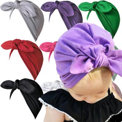 China HZO-18158 Cute Stretchable Baby Girl Hat Newborn Boy Hood Solid Plush Donuts Infant Skullcap for sale