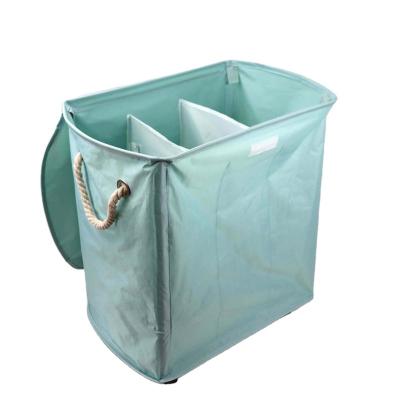 China Durable Waterproof Laundry Hamper With Lid , Large Storage Basket Sorter 3 Section Bag Covering Organizer With Wheels for sale