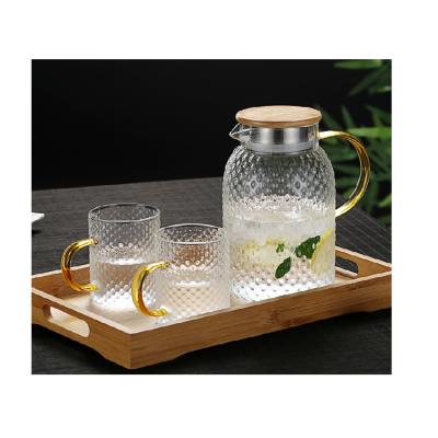 China Viable Wholesale Heat Resistant Glass Pitcher Wooden Low Glass Water Jug With Plastic Lid for sale