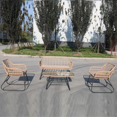 China Outdoor Modern Four-Piece Iron Rattan Dining Set Balcony Rattan Patio Wicker Chairs for sale