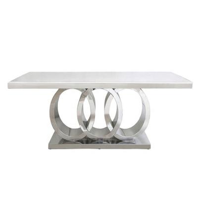 China Modern Style Marble Dining Table with a Chrome Interlocking Base for sale