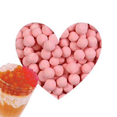 China Beautiful unfrozen in colorful pink tea tapioca pearl for bubble tea for sale