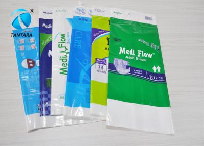 Chine Le conditionnement en plastique en plastique coloré de serviette hygiénique met en sac AVEC la poignée de longueur de main à vendre