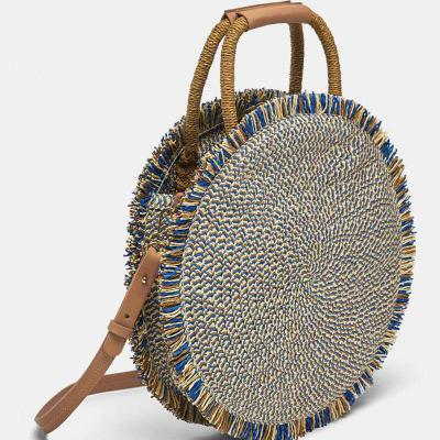 China Fashion Multifunctional Round Shaped Straw Crossbody Bag Womens Beach Woven Tote Bag With Tassel for sale