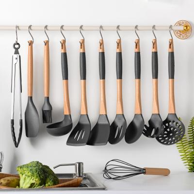 China Sustainable Custom Printed 11 Pcs Heat Resistant Non-Slip Wood Handle Non-Stick Kitchen Utensils Set With Hanging Hook for sale