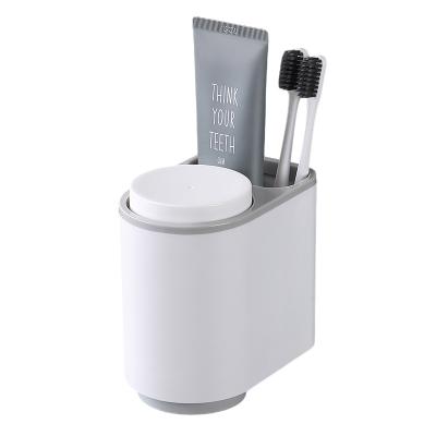 China Multifunctional Toothbrush Holder Wall Mounted Magnetic Toothbrush Holder Stocked With Cup for sale