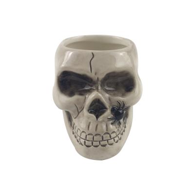 China Europe style custom funny tabletop ceramic skull pen pencil holder for desk for sale