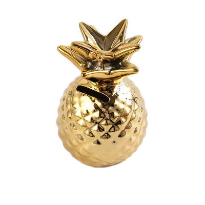 China Europe Style Cute Adult White Ceramic Piggy Bank Coins Pineapple Shape Golden Piggy Savings Bank For Party Makers for sale