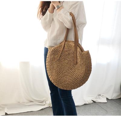 China Classic Round Beach Tote Net Crochet Bag Handmade Straw Woven Vacation Bag Fashion Rattan Shoulder for sale