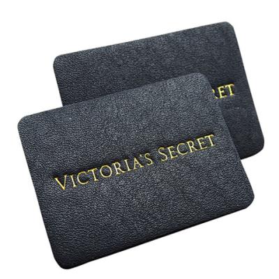 China apparel genuine leather label stamped tags black leather patch logo factory for sale