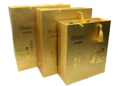 China Custom Printed Luxury Gold Paper Gift Bags Packaging with Embossed LOGO for Sale for sale