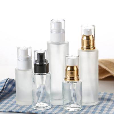 China Free Sample Customized Personal Care Frosted Essential Oil Bottles Glass Emulsion Cream Bottle With Pump Spray for sale