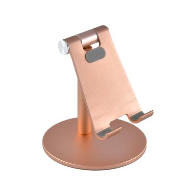 China Universal Adjustable Foldable ABS Desktop Smartphone Cell Mobile Phone Stand Table Rotating Plastic Holder for sale