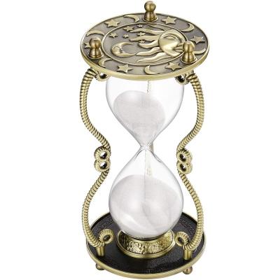 China Modern Hourglass Sand Timer 60 Minute Sun And Moon Engraving White Glass Sandglass Hour Clock Brass Metal Sand Watch For Gift for sale