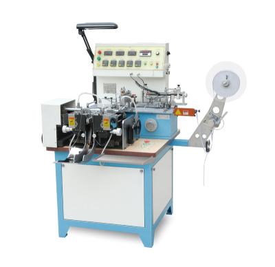 China Textile woven label slitters/fabric printed label cutter and fold machine for satin ribbon, garment care labels and nylon tape for sale