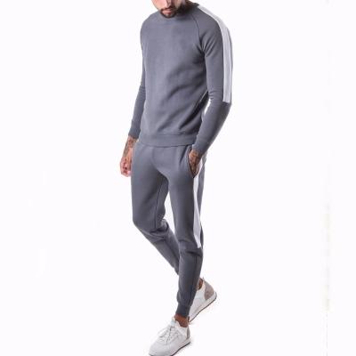 China Wholesale Anti-Static Pullover Tracksuits Custom Design Fashion Polyester Jogging Band White Customized Tracksuits for sale