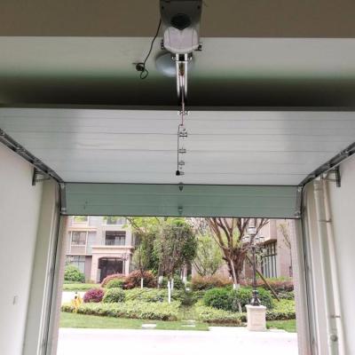 China Heat Insulation Low Prices Chinese Steel Automatic Garage Doors With Pedestrian Door for sale