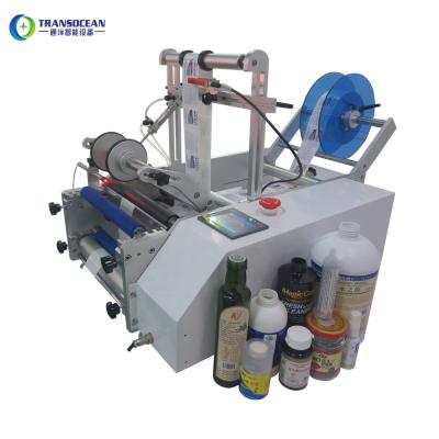 China semi automatic small round bottle food labeling machine for all round bottles for sale