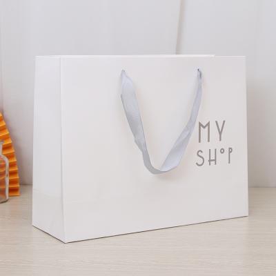 China High Quality Cheaper Durable Eco-Friendly Recyclable Wholesale White Ribbon Logo Paper Bag Luxury Custom Printing Paper Bags With Handle for sale