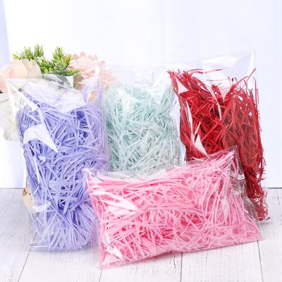 China Waterproof Wholesale High Quality Decorative Bulk 100g/bag Color Shredded Fold Paper For Filler Gift Baskets Gift Bag Packaging Box for sale