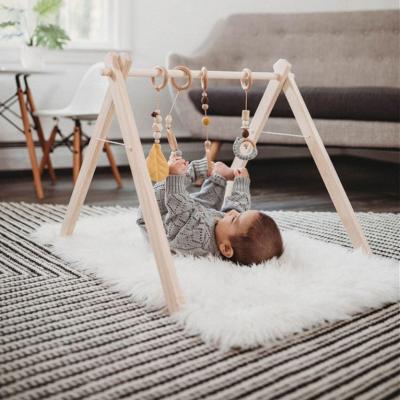 China Toy Winning Indoor Wooden Baby Educational Gym Wooden Play Gym with 3 Teetng Wooden Rattle Toys Foldable Baby Gym Frame Activity for sale