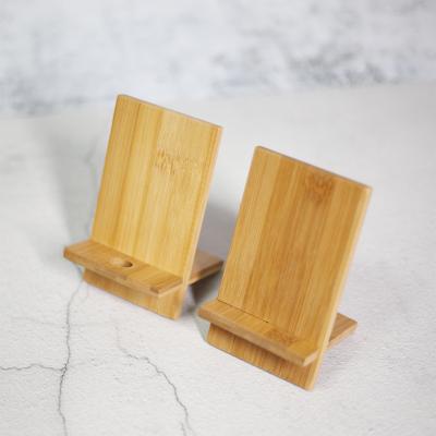 China Viable Wholesale Multi Function Eco Desk Station Wooden Cell Phone Stand For iPhone for sale