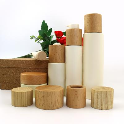 China Custom Round Cosmetic Bottle Caps Non Spill Cream Bottle Wooden Lid for sale