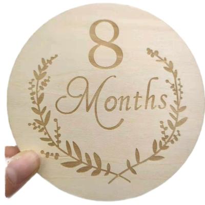 China 13-Piece Newborn Baby Monthly Milestone One-Sided Laser Cut Folk Art Words Poplar Stand for Photographs for sale