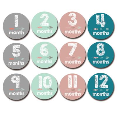 China Wooden Baby Monthly Milestone Discs Double Sided Discs Round shaped - Includes 13 Cards with Drawstring Bag for sale