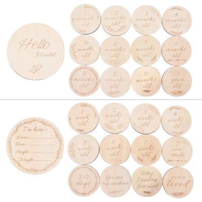 China Baby Monthly Milestone Wooden Cards Baby Gifts Newborn Photography Props Double Sided Engraved Discs for sale