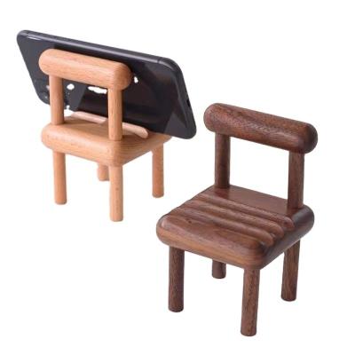 China New wooden chair beech mobile phone holder creative small stool holder desktop  mobile phone holder for lazy people for sale