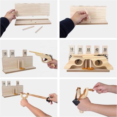 China Customized Wooden Multi-Shot Rubber Band Pistol Wooden Slingshots Toy Wooden Number Target Stand for sale