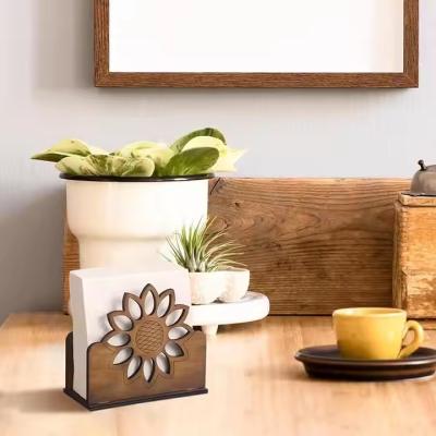 Chine Nouveau porte-serviette en bois massif sculpté en tournesol Dispenser de tissus en bois élégant pour la décoration de table de restaurant à vendre