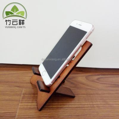 China Universal mobile phone base wooden mobile phone stand laser cutting phone holder for sale