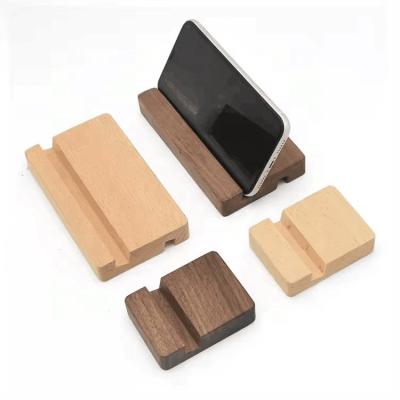 China Wood Cell Phone Stand Wooden Mobile Phone Holder Universal Portable Desktop Smartphone Stand for sale