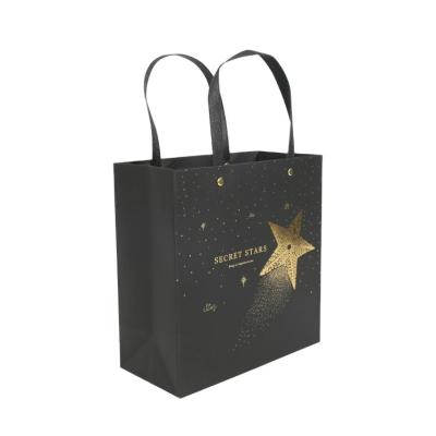 China Recycled Materials Custom Printed Black Luxury Gold Foil Garment Paper Bags for sale