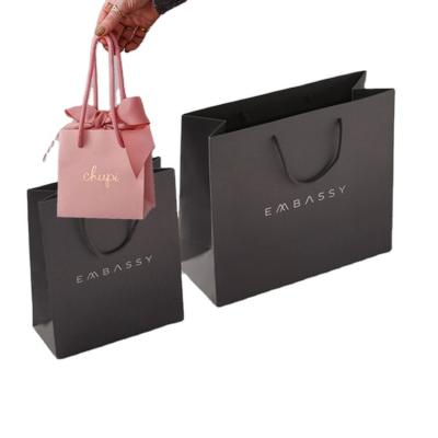 China Recyclable luxury boutique retail shopping gift packaging custom printed small black paper bag with your own logo for sale