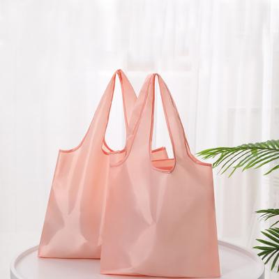 China 2022 Reusable New Solid Color Foldable Reusable Eco-friendly Waterproof Shopping Backpack Tote Grocery Foldable Storage Hand Bags for sale