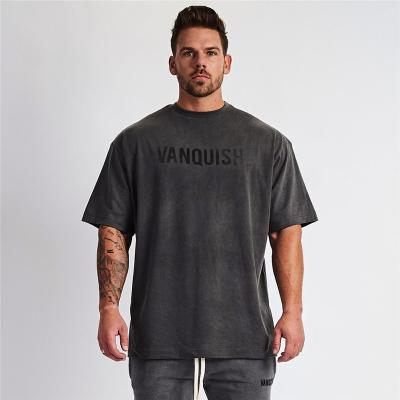 China Anti-Wrinkle Plain Gym Clothing Fitness Use Oversized Gym Sportswear Men's Loose Short Sleeve T-shirt Muscle Bodybuilding T-shirt for sale