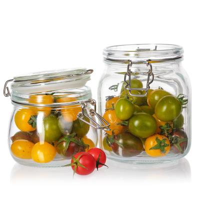 China Food Factory Use 1Oz 4Oz 8Oz Round Shaped Clear Empty Storage Container Glass Food Jars With Clip Lid for sale