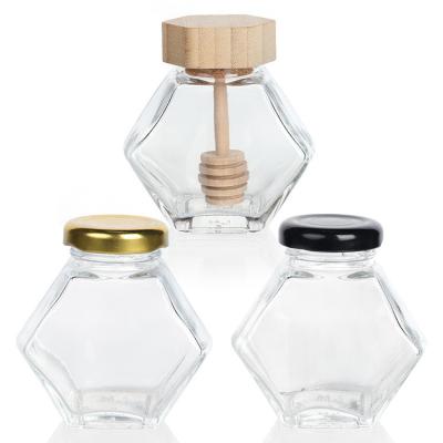 China Hexagon Thickened Transparent Food Storage Different Sizes Glass Honey Jars With Sealed Metal Lids for sale