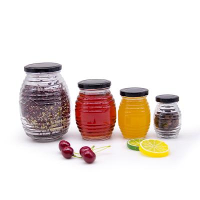 Cina Etichetta personalizzata Forma esagonale 100ml 180ml 380ml Vaso di vetro di marmellata di miele per miele Olive Fruit in vendita